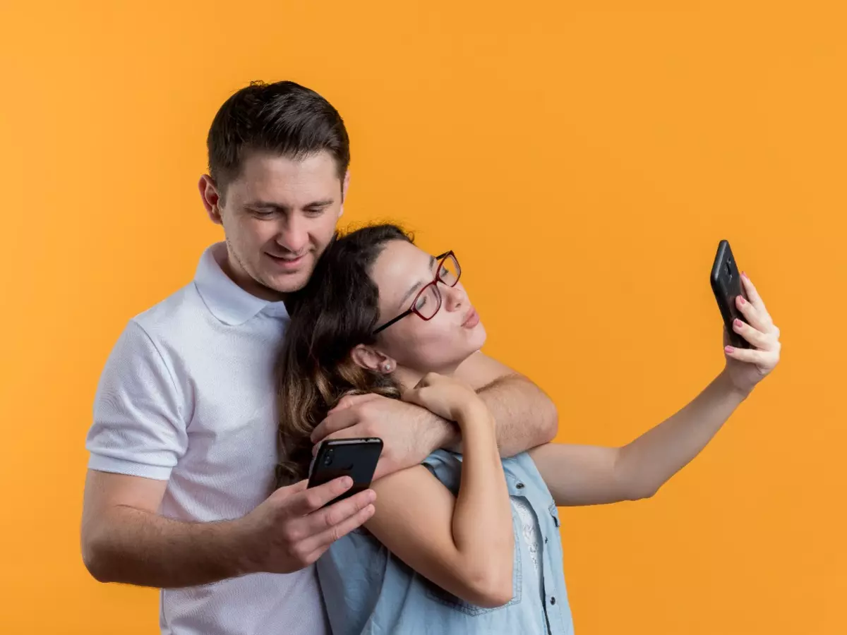 young-couple-man-woman-casual-clothes-standing-together-doing-selfie-happy-love-having-fun-orange-wall-67f4ded316411 Indiatimes